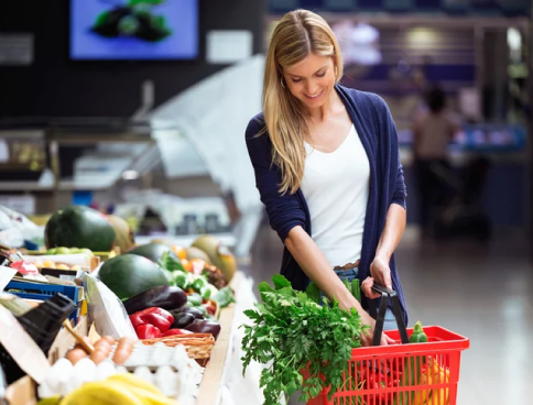A woman grocery shopping
